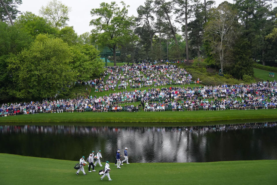 Si Woo Kim, of South Korea, Tiger Woods, Rory McIlroy, of Northern Ireland, and Fred Couples walk on the 16th hole during a practice for the Masters golf tournament at Augusta National Golf Club, Monday, April 3, 2023, in Augusta, Ga. (AP Photo/Jae C. Hong)