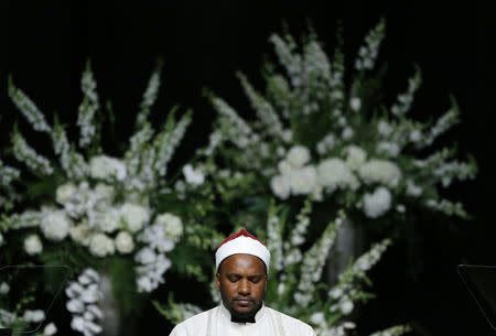 Hamzah Abdul Malik gives a quranic recitation at a memorial service. REUTERS/Lucas Jackson