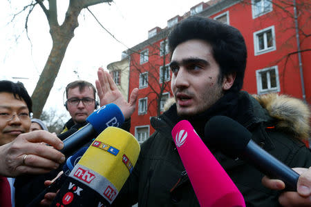 Syrian refugee Anas Modamani who takes Facebook to court over a selfie with Merkel speaks to journalits outside the district court in Wuerzburg, Germany February 6, 2017. REUTERS/Ralph Orlowski