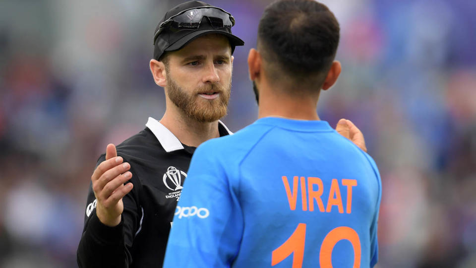 Kane Williamson and Virat Kohli shake hands after their World Cup clash. (Photo by DIBYANGSHU SARKAR/AFP/Getty Images)
