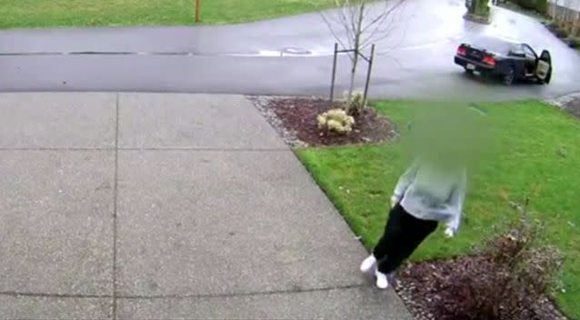The woman is seen leaving a car and walking up a driveway. Source: King 5