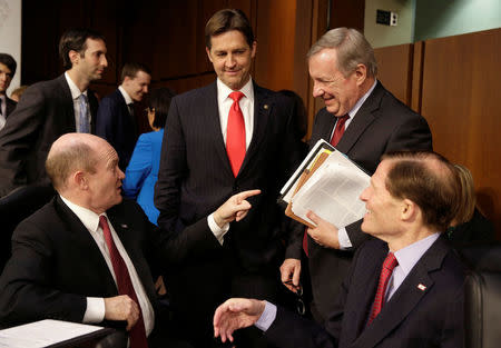 Senators Chris Coons (D-DE), Ben Sasse, (R-NE), Richard Durbin (D-IL) and Richard Blumenthal speak during a break in Supreme Court nominee judge Neil Gorsuch's testimony to the Senate Judiciary Committee confirmation hearing on Capitol Hill in Washington, U.S., March 21, 2017. REUTERS/Joshua Roberts