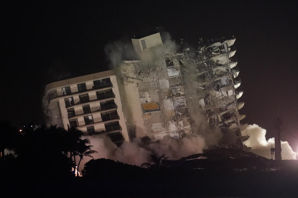 FILE - The damaged remaining structure at the Champlain Towers South condo building collapses in a controlled demolition, July 4, 2021, in Surfside, Fla. The probe into the 2021 collapse of the beachfront condominium building that killed 98 people in South Florida should be completed by the fourth anniversary of the disaster, federal officials said Thursday, Sept. 7, 2023. (AP Photo/Lynne Sladky, File)