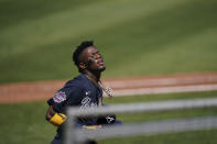 Atlanta Braves' Ronald Acuna Jr., (13) walks off the field after scoring in the first inning during a spring training baseball game against the Boston Red Sox on Monday, March 1, 2021, in Fort Myers, Fla. (AP Photo/Brynn Anderson)