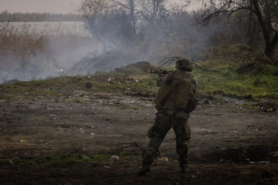 A member of the foreign legion fires on a Russian position from the bank of the Dnipro River during a small incursion operation in Kherson yesterday (Getty Images)