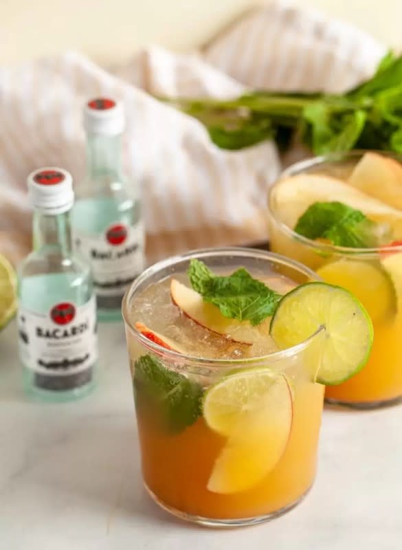 <p>Thyme & Joy</p><p>Apple cider, pumpkin puree and pumpkin pie spice are combined with a standard mojito to make this festive fall mojito cocktail.</p><p><strong>Get the recipe: <a href="https://thymeandjoy.com/thanksgiving-mojito/" rel="nofollow noopener" target="_blank" data-ylk="slk:Thanksgiving Mojitos;elm:context_link;itc:0;sec:content-canvas" class="link ">Thanksgiving Mojitos</a></strong></p>