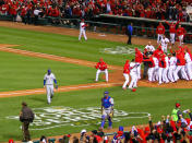 ST LOUIS, MO - OCTOBER 27: David Freese #23 and the St. Louis Cardinals celebrate on the field after hitting a walk off solo home run in the 11th inning to win Game Six of the MLB World Series against the Texas Rangers at Busch Stadium on October 27, 2011 in St Louis, Missouri. The Cardinals won 10-9. (Photo by Dilip Vishwanat/Getty Images)