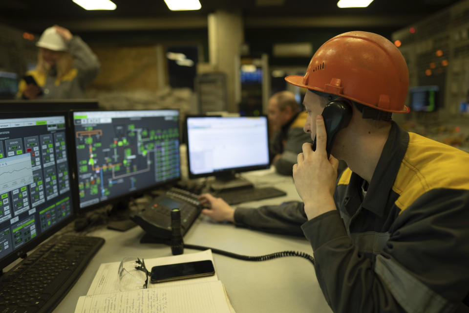 A worker transmits the parameters from the control panel of a power plant in central Ukraine, Thursday, Jan. 5, 2023. When Ukraine was at peace, its energy workers were largely unheralded. War made them heroes. They're proving to be Ukraine's line of defense against repeated Russian missile and drone strikes targeting the energy grid and inflicting the misery of blackouts in winter. (AP Photo/Evgeniy Maloletka)