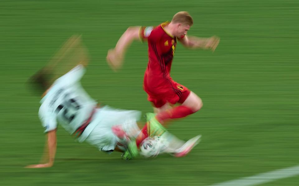 Kevin De Bruyne of Belgium is tackled by Joao Palhinha of Portugal during the UEFA Euro 2020 Championship Round of 16 match  - Diego Souto/Quality Sport Images/Getty Images