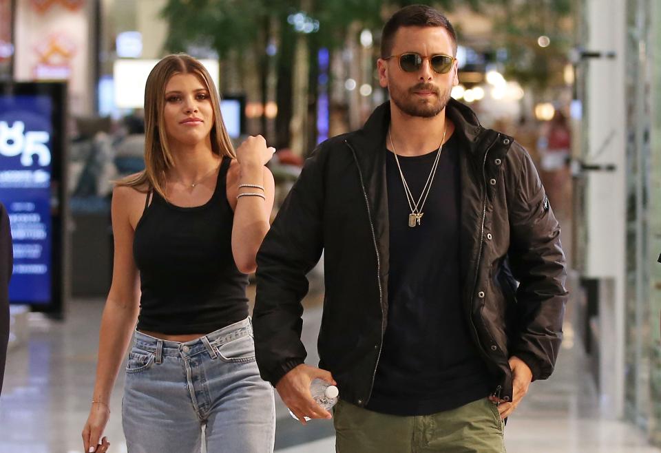 Sofia Richie and Scott Disick in the street