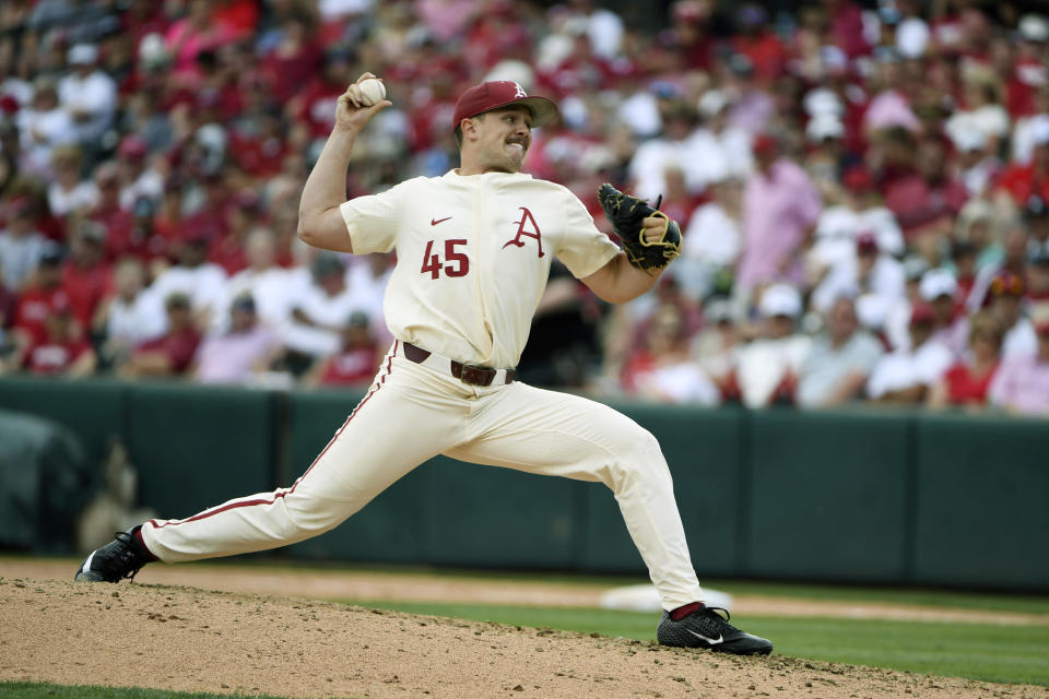 FILE - Arkansas pitcher Kevin Kopps throws a pitch against Mississippi during the sixth inning of Game 2 at the NCAA college baseball super regional tournament in Fayetteville, Ark., in this Sunday, June 9, 2019, file photo. Top-ranked Arkansas is closing in on its first SEC championship in baseball since 2004 after winning two of three one-run games at Tennessee. (AP Photo/Michael Woods, File)