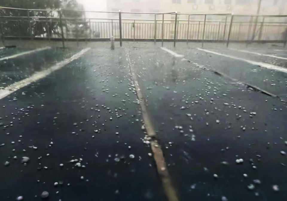 Hailstones are seen during a rain storm in Nanchang in eastern China's Jiangxi province Tuesday, April 2, 2024. Violent rain and hailstorms have killed some people in eastern China's Jiangxi province this week, including people who fell from their apartments in a high-rise building. (Chinatopix Via AP) CHINA OUT