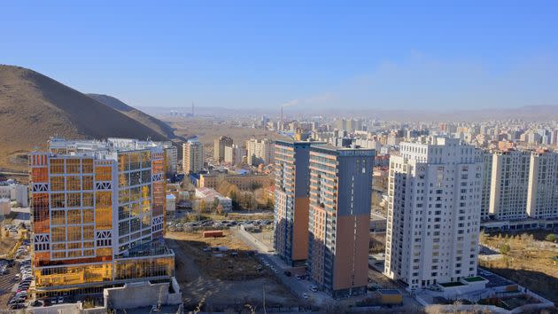 A view of Ulaanbaatar's skyline from the Zaisan World War II memorial, the city's highest point, in October 2023. The new trade center is seen on the left, while smokestacks are visible on the horizon.