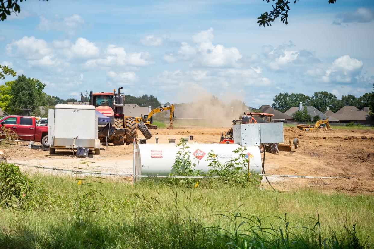 Construction work underway on a detention pond at the Corner of Republic Ave & Lake Farm Road in Lafayette, LA. Tuesday, Aug. 10, 2021.
