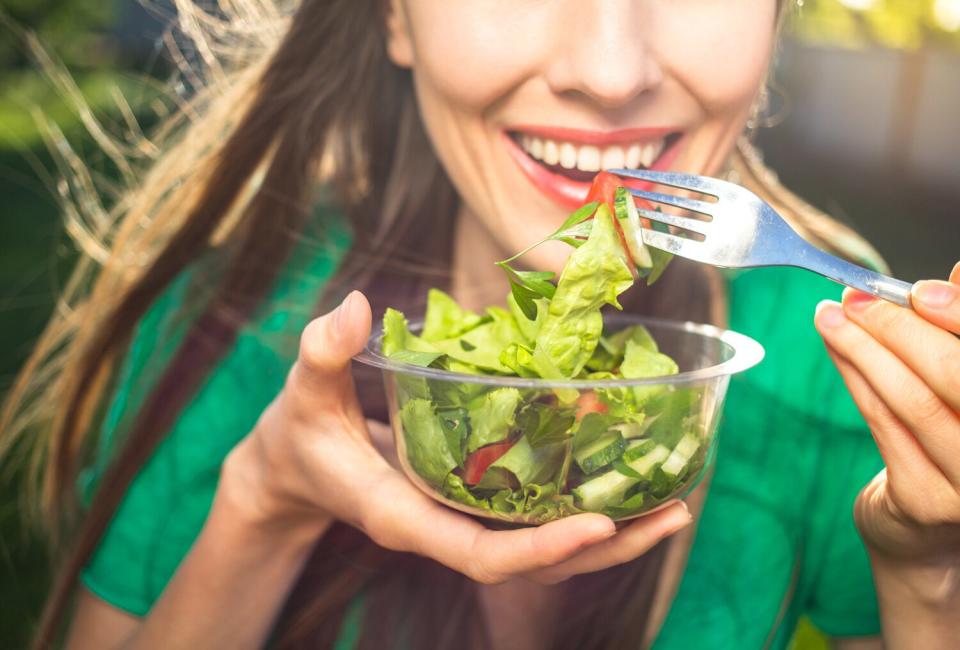 Woman eating healthy salad