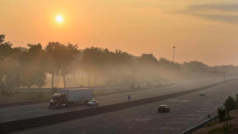 Thick smoke from fireworks fired hours earlier hung in the air over I-435 in Overland Park Sunday morning, July 5, 2020. The National Weather Service issued a special weather advisory warning of unhealthy conditions due to an air inversion that kept the smoke close to the ground.