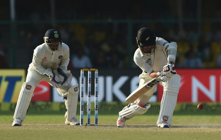 New Zealand's Luke Ronchi plays a defensive shot during the fourth day of the first test match against India at Green Park Stadium in Kanpur on September 25, 2016