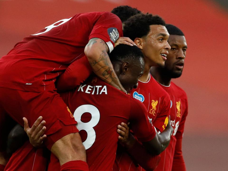 Liverpool celebrate after Keita opens the scoring: POOL/AFP