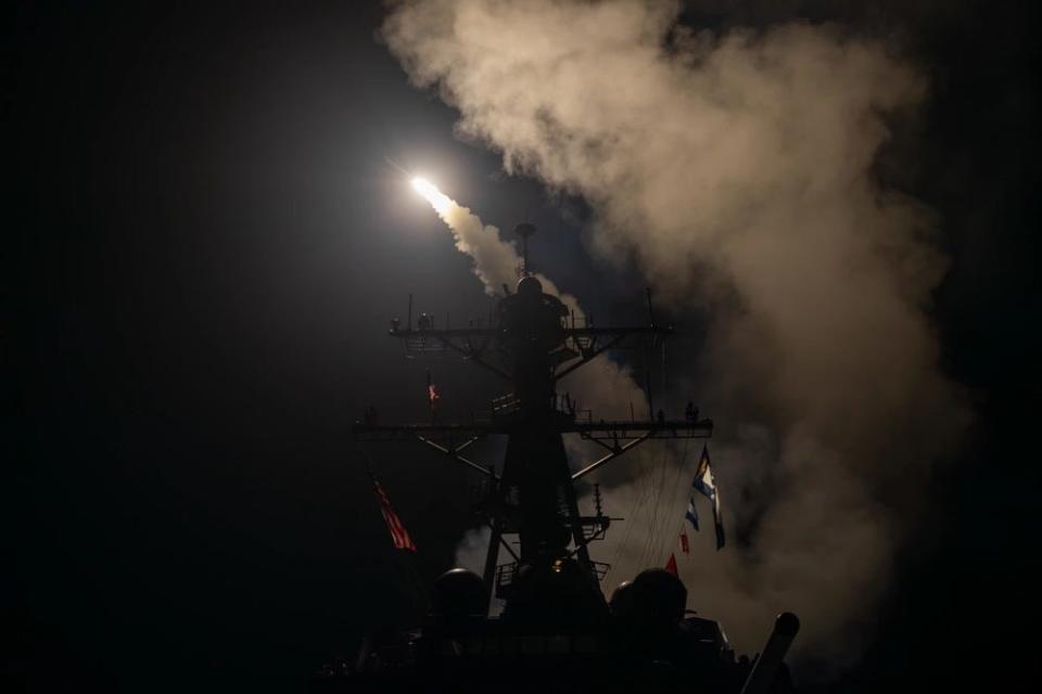 The guided-missile destroyer USS Gravely launches a Tomahawk missile