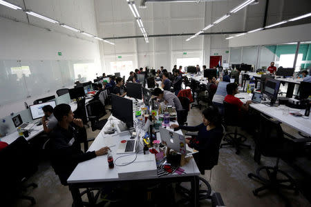 Employees of San Francisco-based software company Wizeline, work at the company's offices in Guadalajara, Mexico October 5, 2017. Picture taken October 5, 2017. REUTERS/Daniel Becerril