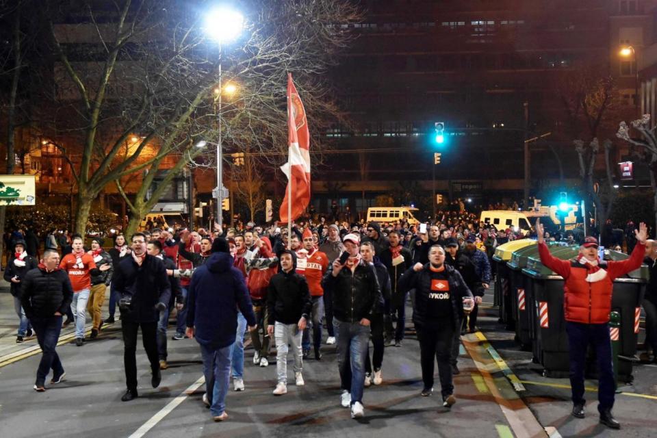 Spartak Moscow supporters chant as they walk through the street in Bilbao (EPA)