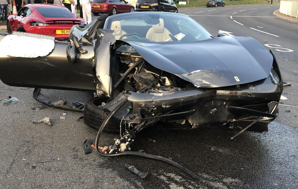 The grey Ferrari 458 following the collision in Sheffield (Picture: SWNS)