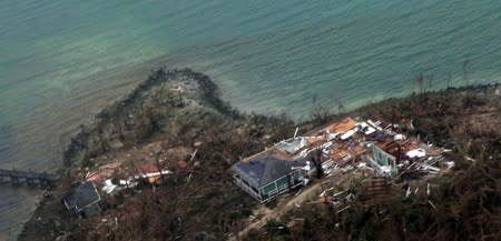 Aerial view of a row of damaged houses in the aftermath of Hurricane Dorian in the Bahamas