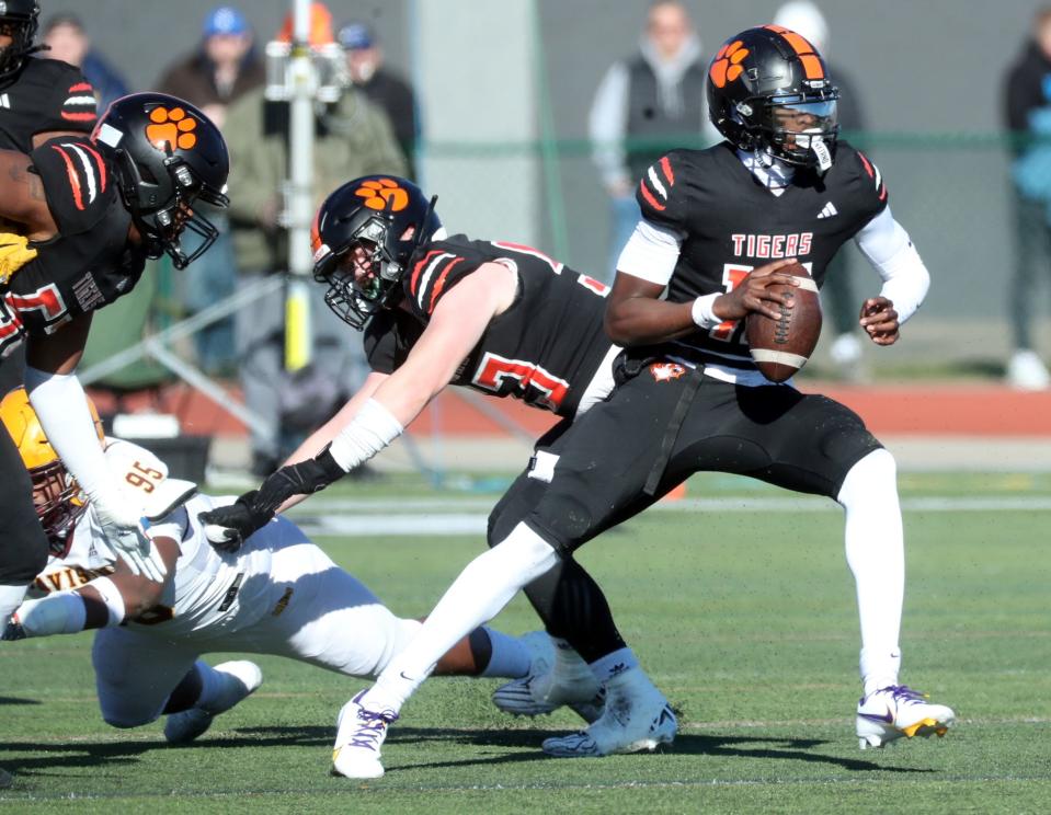 Belleville quarterback Bryce Underwood passes against Davison during first-half action at Novi High School on Saturday, Nov. 18, 2023.