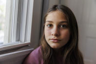 Scarlett Goddard Strahan, 11, poses for a portrait at her home on Tuesday, Aug. 20, 2024, in Sacramento, Calif. (AP Photo/Juliana Yamada)