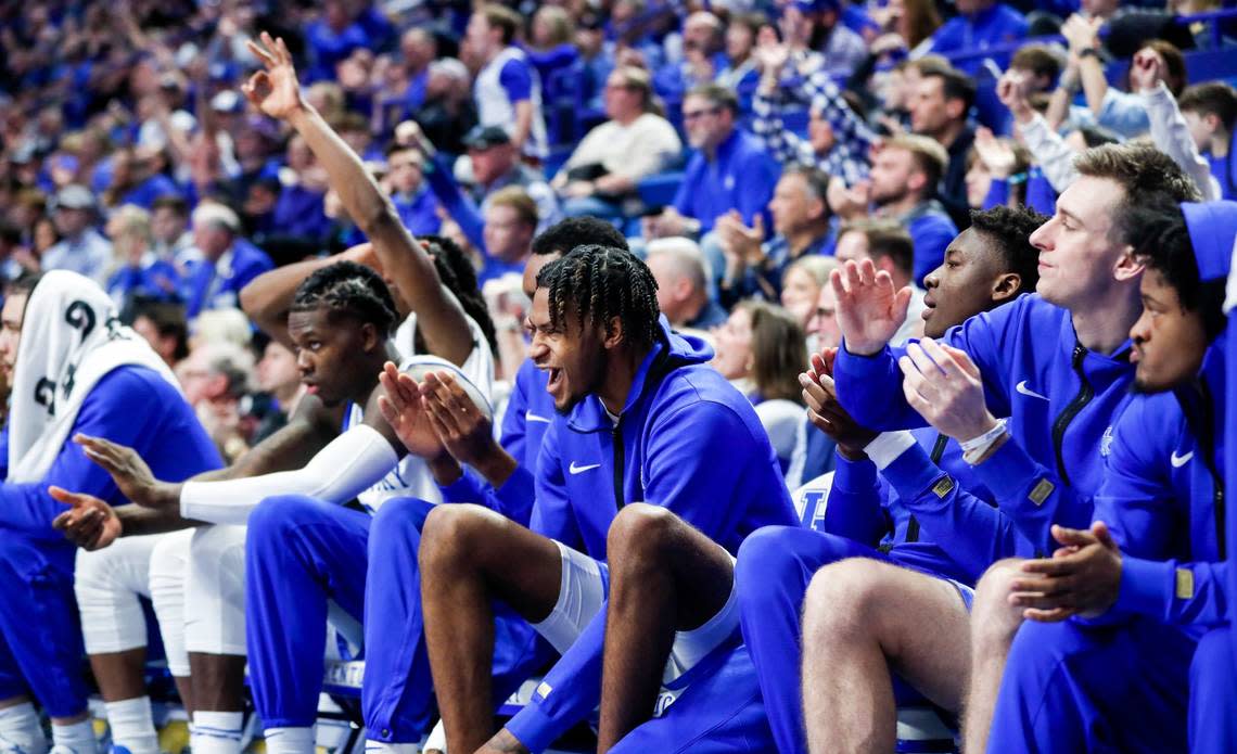 Kentucky forward Daimion Collins celebrates his teammates scoring while sitting on the bench against the Florida Gators on Saturday.