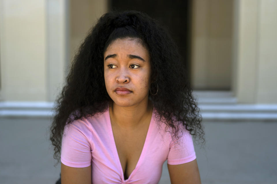 Marina Aina, a 21-year-old student majoring in American Studies at Pomona College, poses for photos on the school's campus in Claremont, Calif., Thursday, Sept. 22, 2022. Aina was used to getting paid for her internships and could not see taking an unpaid opportunity over a summer job. "If I felt that it wasn't compensated then I wouldn't go for it because I wouldn't have the funds to cover it," Aina says. "I wouldn't want to ask my parents, who are helping me pay for college, to pay for something I'm doing over the summer." (AP Photo/Jae C. Hong)