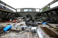 A military boot is seen at an Armenian military truck which was seized by the Azerbaijan army during the fighting over the breakaway region of Nagorno-Karabakh, near the city of Barda