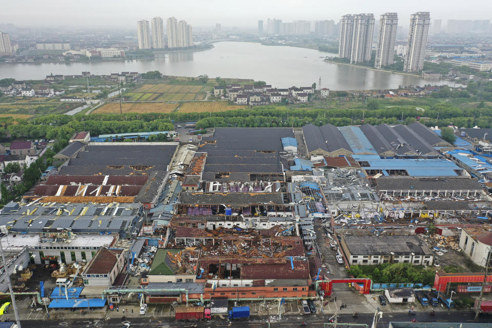 Damage to buildings from a reported tornado is seen in an aerial view in Shengze township in Suzhou in eastern China's Jiangsu Province, Saturday, May 15, 2021. Two tornadoes killed several people in central and eastern China and left hundreds of others injured, officials and state media reported Saturday. (Chinatopix via AP)