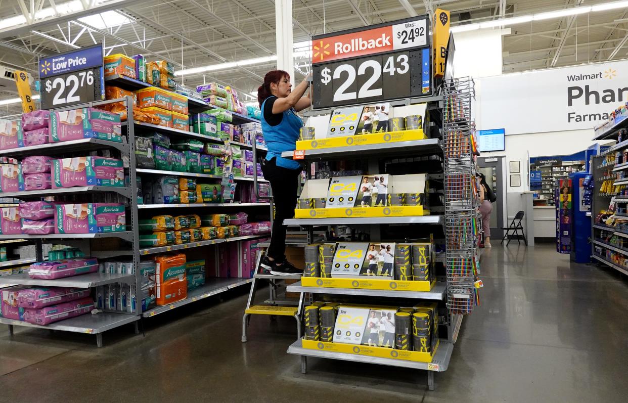 A worker stocks the shelves at a Walmart store on January 24, 2023 in Miami, Florida.