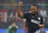 Inter Milan's Joel Obi celebrates after scoring against AC Milan during their Italian Serie A soccer match at the San Siro stadium in Milan November 23, 2014. REUTERS/Alessandro Garofalo