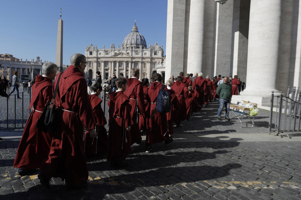 Faithful arrive in St. Peter's Square to attend Pope Francis' Angelus noon prayer at the Vatican, Sunday, Feb. 17, 2019. (AP Photo/Gregorio Borgia)