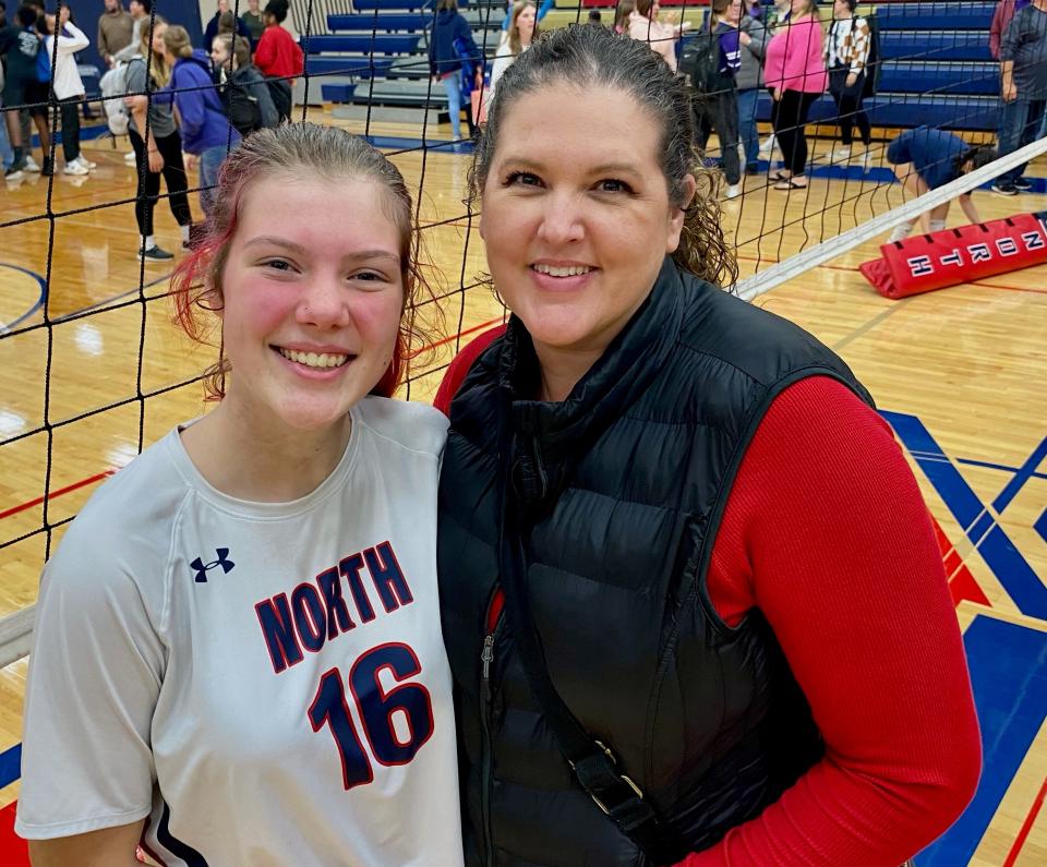 Belvidere North junior outside hitter Kylie Swenson, left, poses with her mom, former Belvidere two-time NIC-10 MVP Kelly McLester, after North in straight sets on Thursday, Oct. 19, 2023 to finish the conference season 18-0.