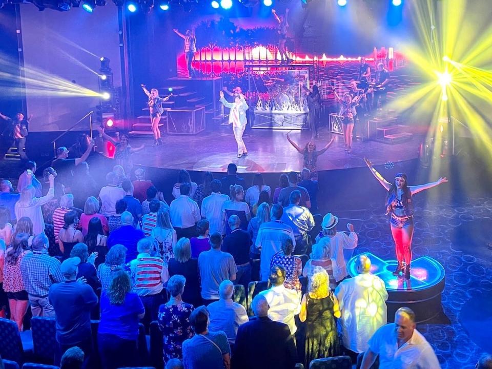 Dancers perform to a crowd onboard the Carnival Vista cruise ship.