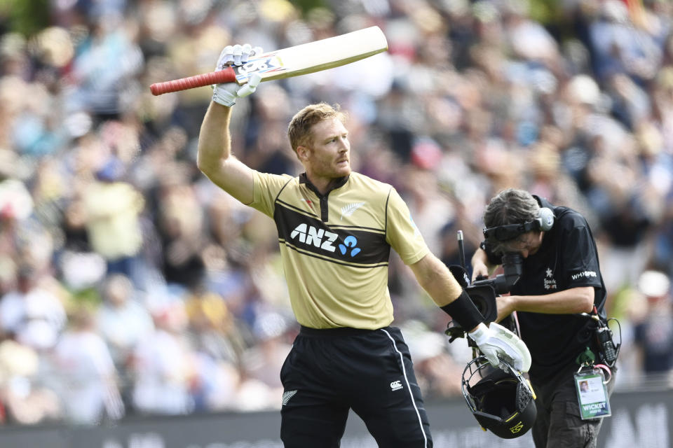 New Zealand batsman Martin Guptill waves to the crowd as he leaves the field after he was dismissed for 97 runs during the second T20 cricket international between Australia and New Zealand at University Oval In Dunedin, New Zealand, Thursday, Feb. 25, 2021. (Andrew Cornaga/Photosport via AP)