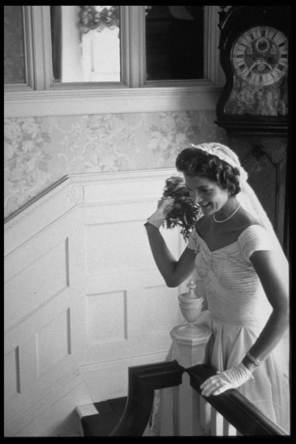 Jackie Kennedy poses for a portrait at the staircase in Hammersmith Farm.