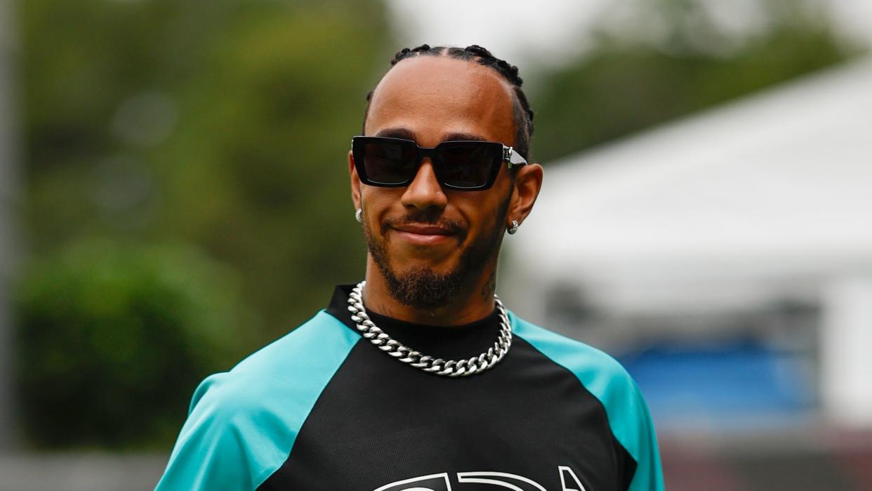 Lewis Hamilton walking through the F1 paddock