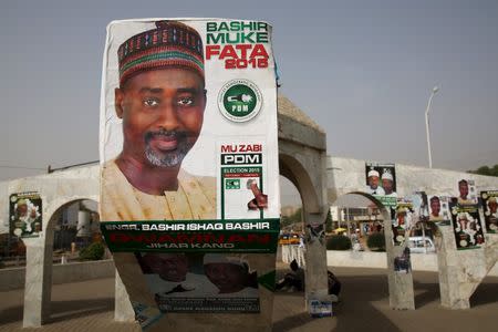 Election posters are seen in Kano March 27, 2015. REUTERS/Goran Tomasevic