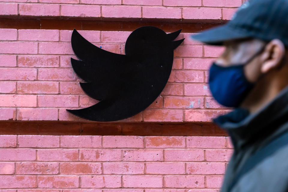 NEW YORK, UNITED STATES - 2020/10/14: A man wearing a face mask walks past a Twitter logo outside their New York City headquarters.
Facebook and Twitter took steps to limit the spread of a controversial New York Post article critical of Joe Biden, sparking outrage among conservatives and stoking debate over how social media platforms should tackle misinformation ahead of the US election. (Photo by John Nacion/SOPA Images/LightRocket via Getty Images)