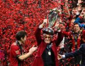 Dec 8, 2018; Atlanta, GA, USA; Atlanta United FC owner Arthur Blank hoists the MLS Cup trophy after defeating the Portland Timbers in the 2018 MLS Cup championship game at Mercedes-Benz Stadium. Mark J. Rebilas-USA TODAY Sports