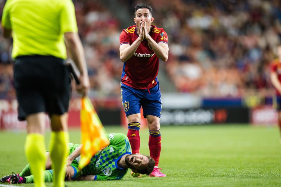 Real Salt Lake defender Bryan Oviedo (3) reacts to a call as Seattle Sounders midfielder Kelyn Rowe (22) lies in the field during a MLS match between Real Salt Lake and the Seattle Sounders at America First Field in Salt Lake City on April 29, 2023. | Ryan Sun, Deseret News