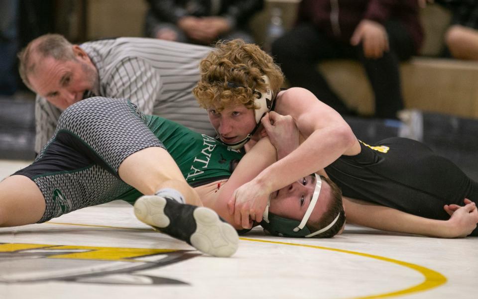 St. John Vianney with Patrick O'Keefe (right), shown wrestling Raritan's Aidan Davis on Monday night as one of its best wrestlers, made a major move up in the Asbury Park Press Top 10.