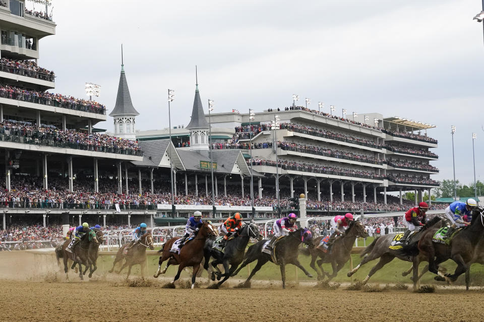 FILE - Javier Castellano, atop Mage, third from left, is seen with others behind the pack as they make the first turn while competing in the 149th running of the Kentucky Derby horse race at Churchill Downs Saturday, May 6, 2023, in Louisville, Ky. Horse deaths marred last year’s Kentucky Derby, Preakness and Breeders’ Cup, with officials finding no single factor to blame. (AP Photo/Julio Cortez, File)
