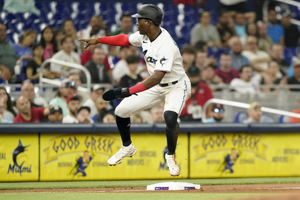 Miami Marlins' Jesus Sanchez is safe at third on a fly hit ball hit by Avisail Garcia during the fourth inning of a baseball game against the St. Louis Cardinals, Thursday, April 21, 2022, in Miami. (AP Photo/Lynne Sladky)