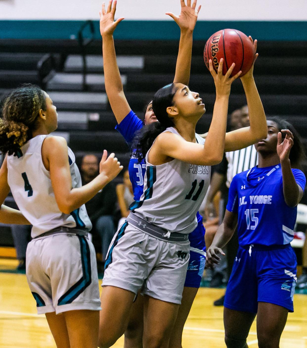 West Port's Ciarra Lake drives to the basket Tuesday againstP.K. Yonge.