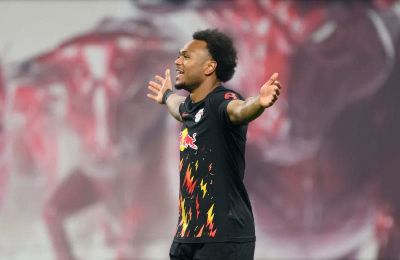 Leipzig's Lois Openda celebrates scoring his side's second goal during the German Bundesliga soccer match between RB Leipzig and Borussia Moenchengladbach at Red Bull Arena. Robert Michael/dpa